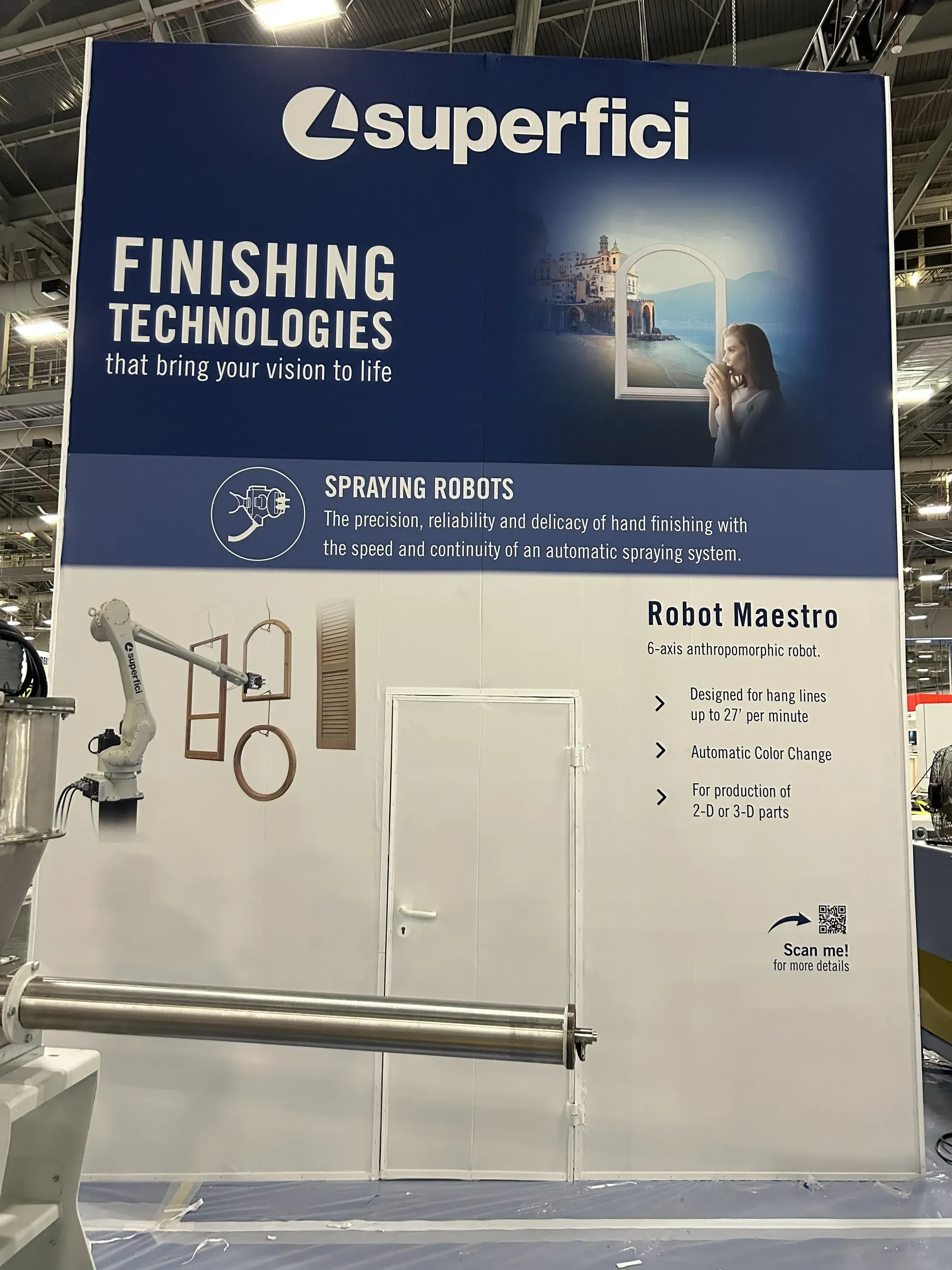 Superfici trade show booth sign showcasing spraying robots and technology.