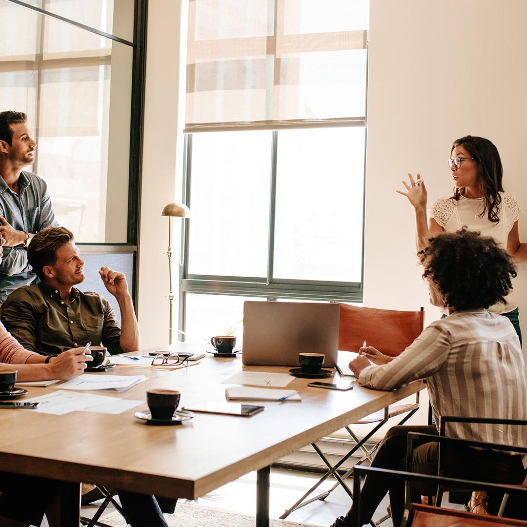 group talking in a board room