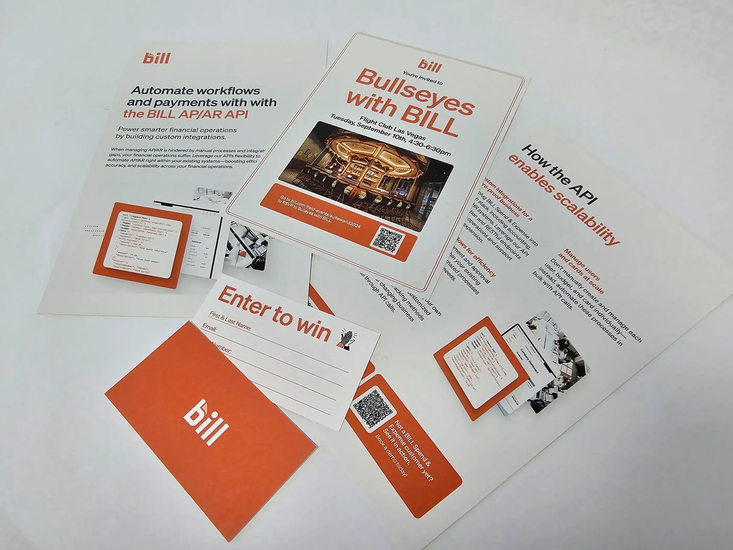 Printed materials for Bill.com, featuring informational flyers, a ‘Bullseyes with BILL’ event invite, and an ‘Enter to Win’ card, highlighting promotional content and event details.” 	3.	Image 3: Lead the Way Event Mar
