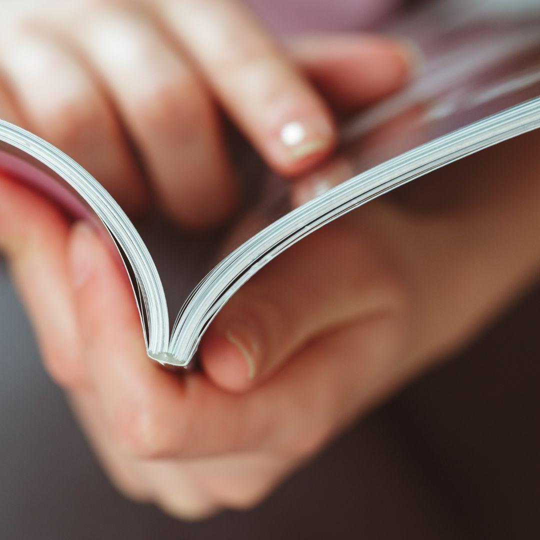 person reading a magazine