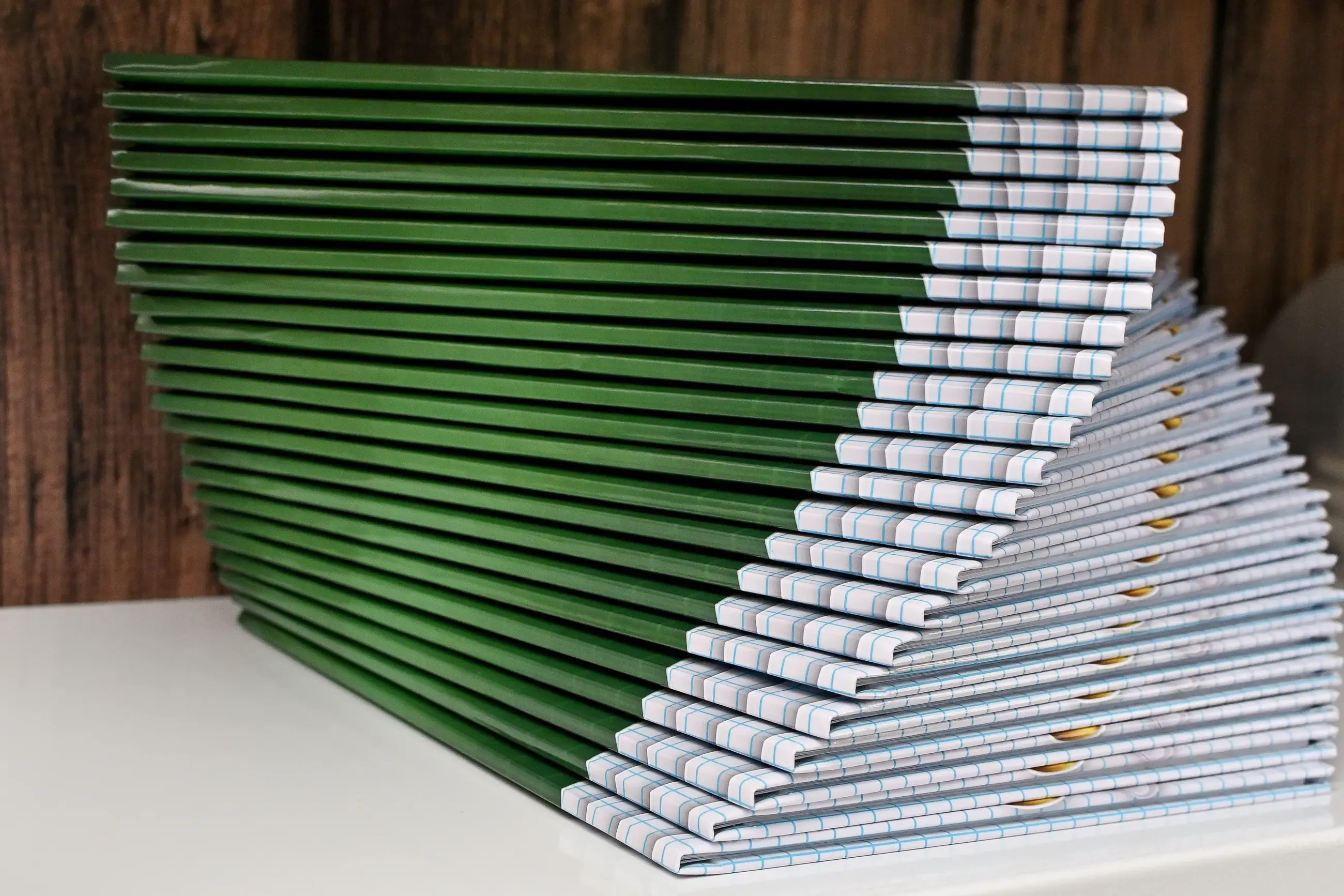 A stack of green hardcover books