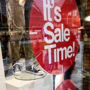A round sales banner in a shop window