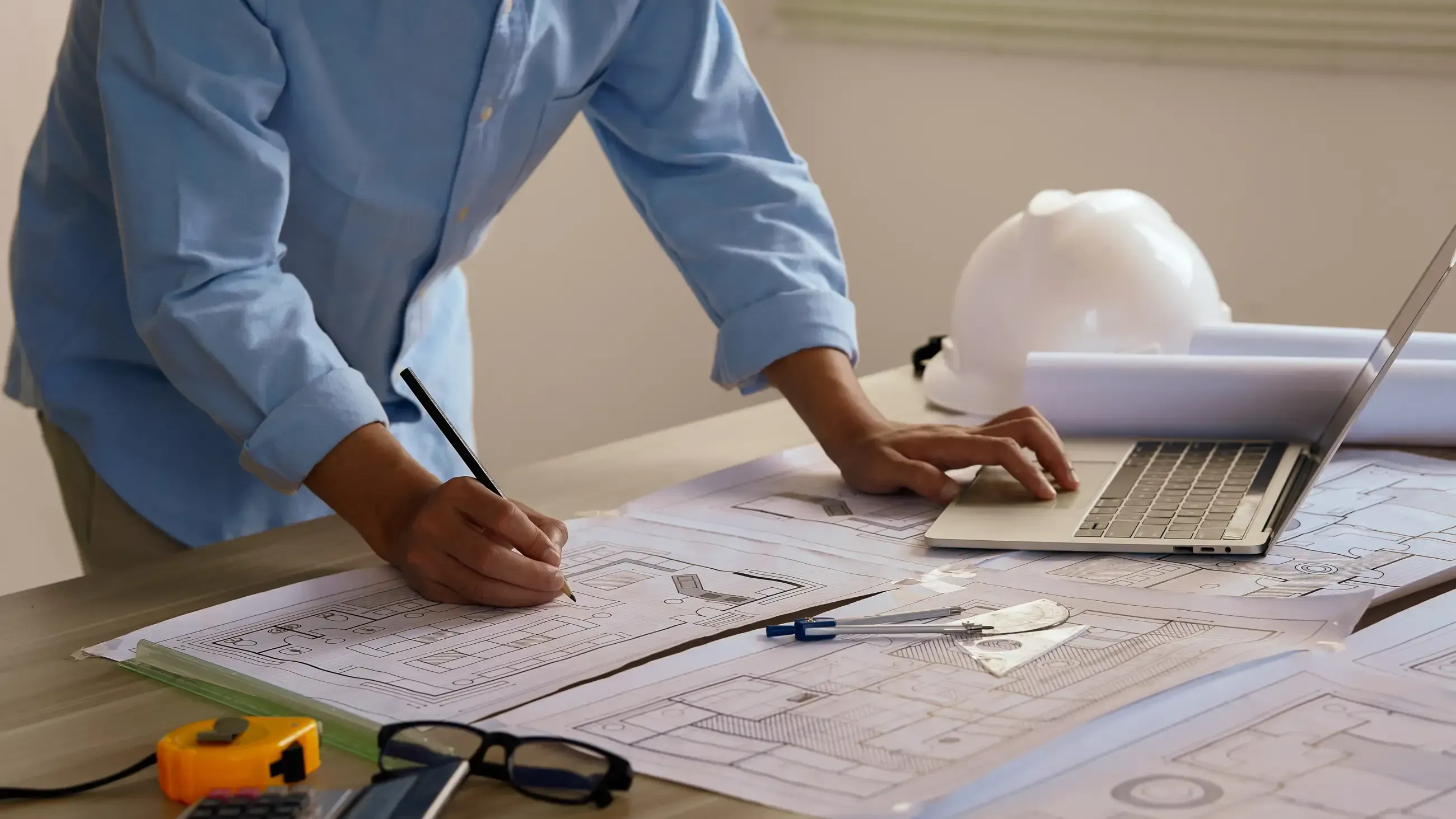 man working on blueprint