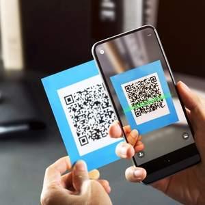 A person scanning a QR code with their phone