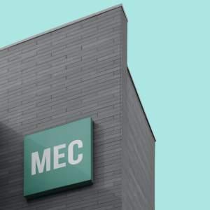A large sign on the outside of an office building