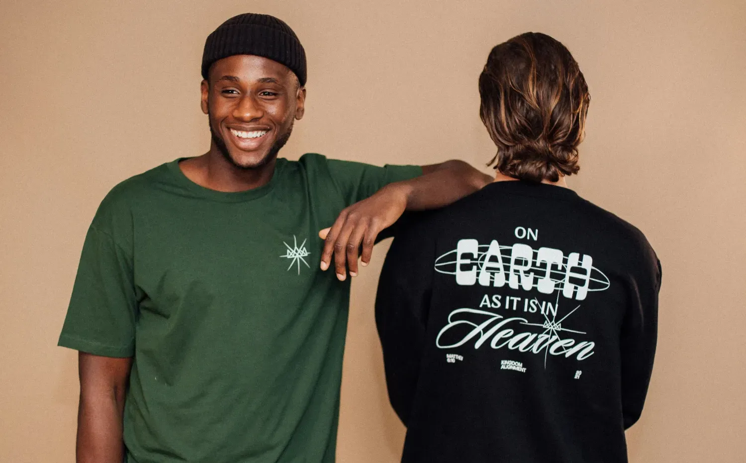 Two people standing with custom printed t-shirts on.