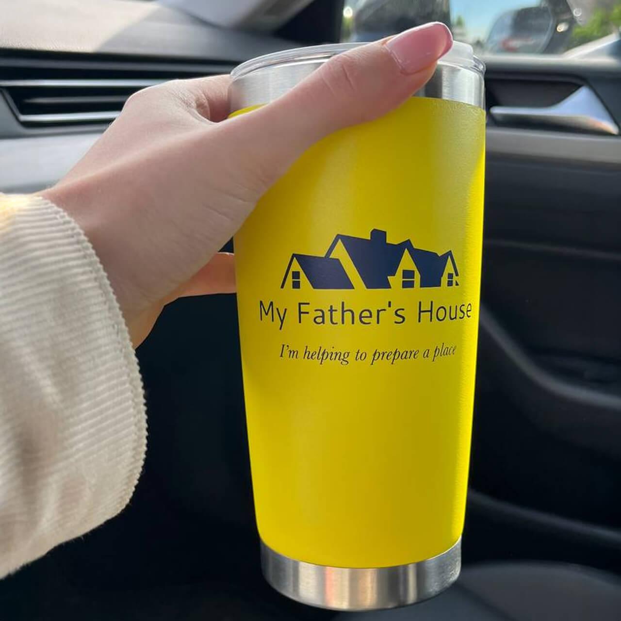 Yellow branded coffee tumbler for real estate agency