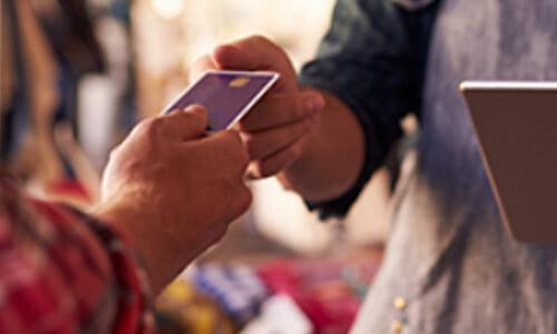 person handing card