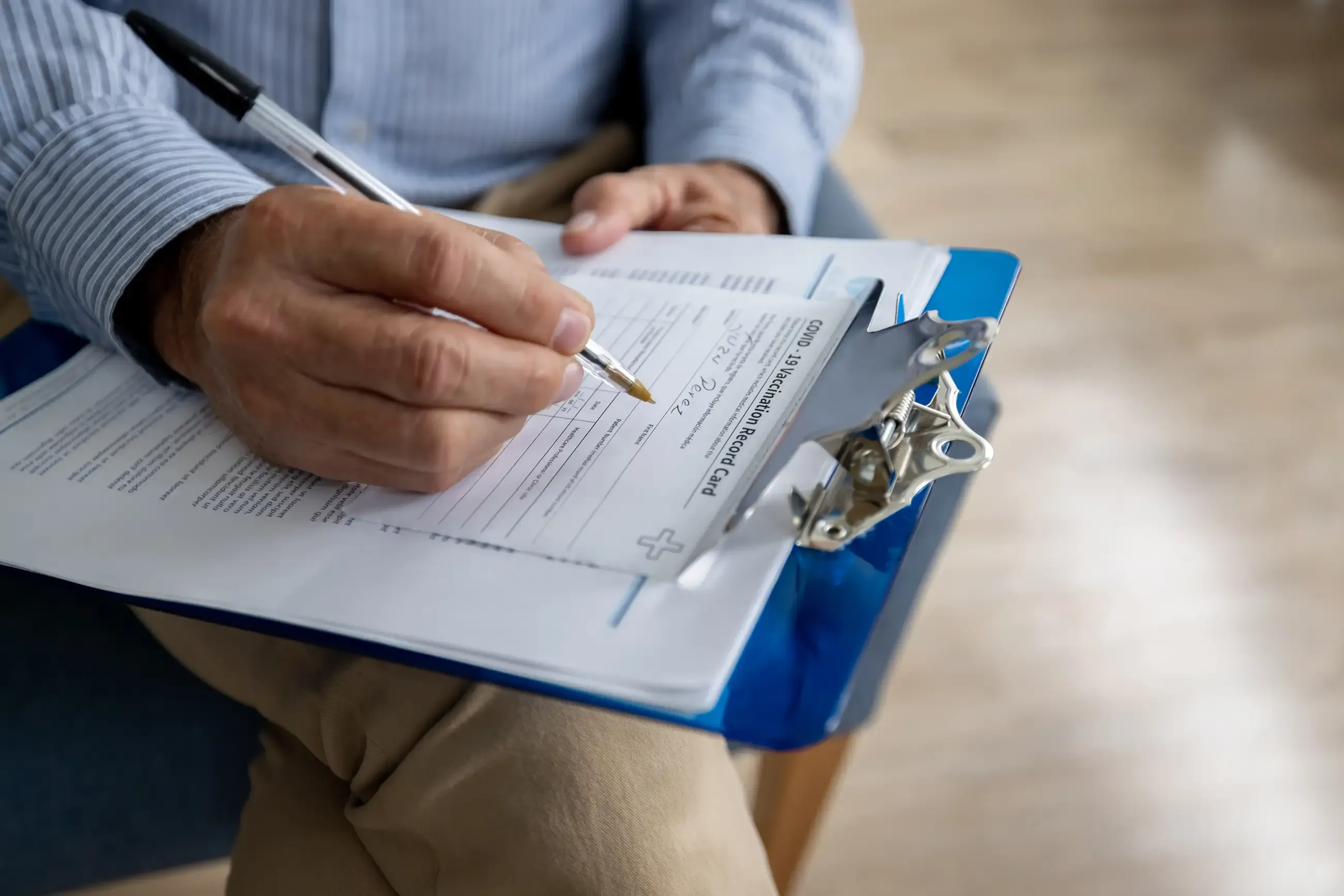 a person filling out a form
