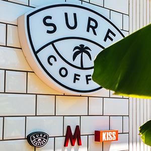 A beach themed coffee shop business sign