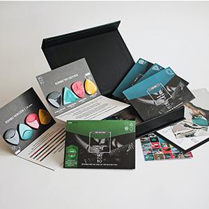 A box of promotional materials spread out on a table