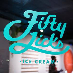 A script font teal ice cream shop logo on a window