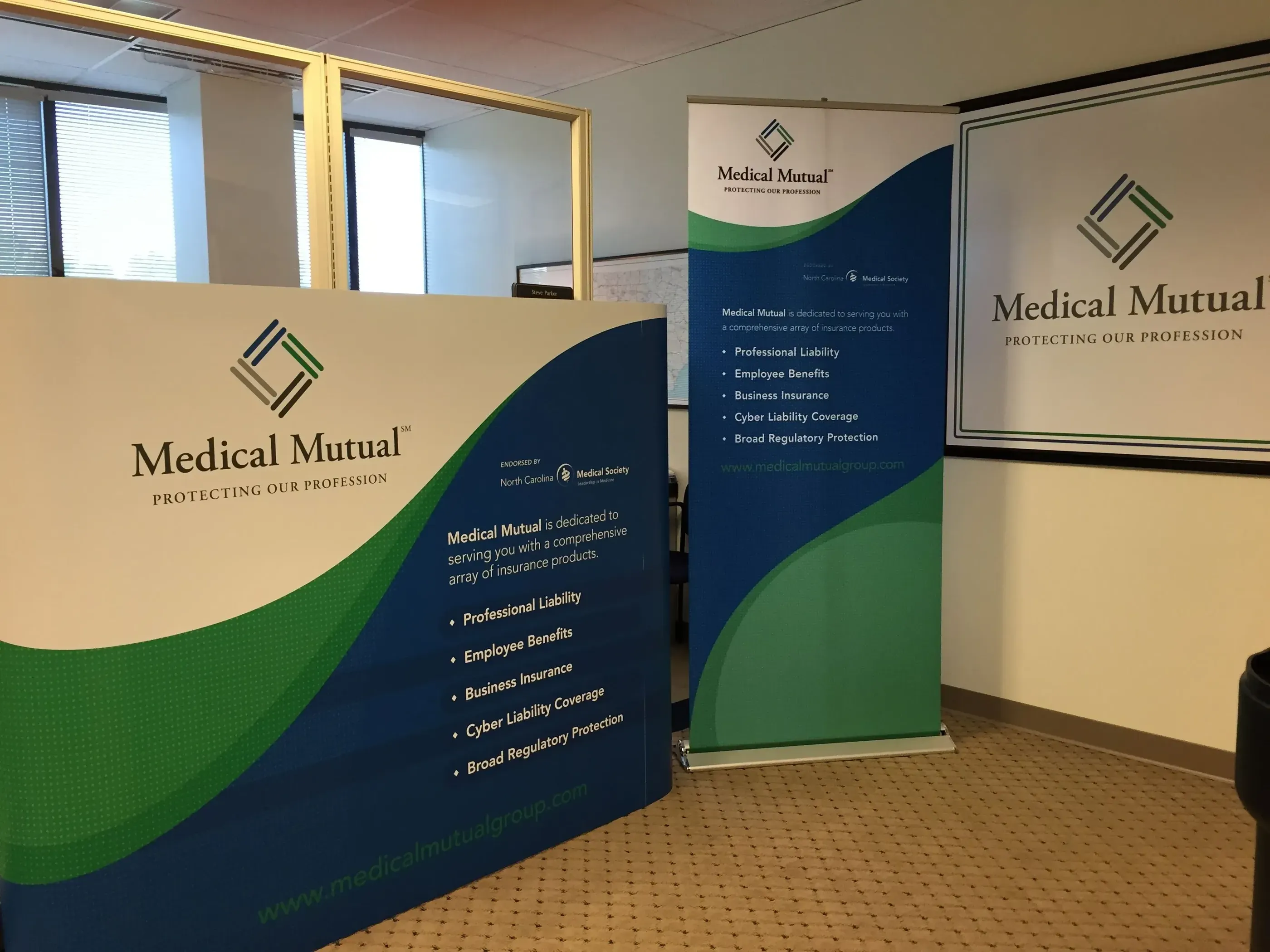 Medical Mutual trade show display with a retractable banner