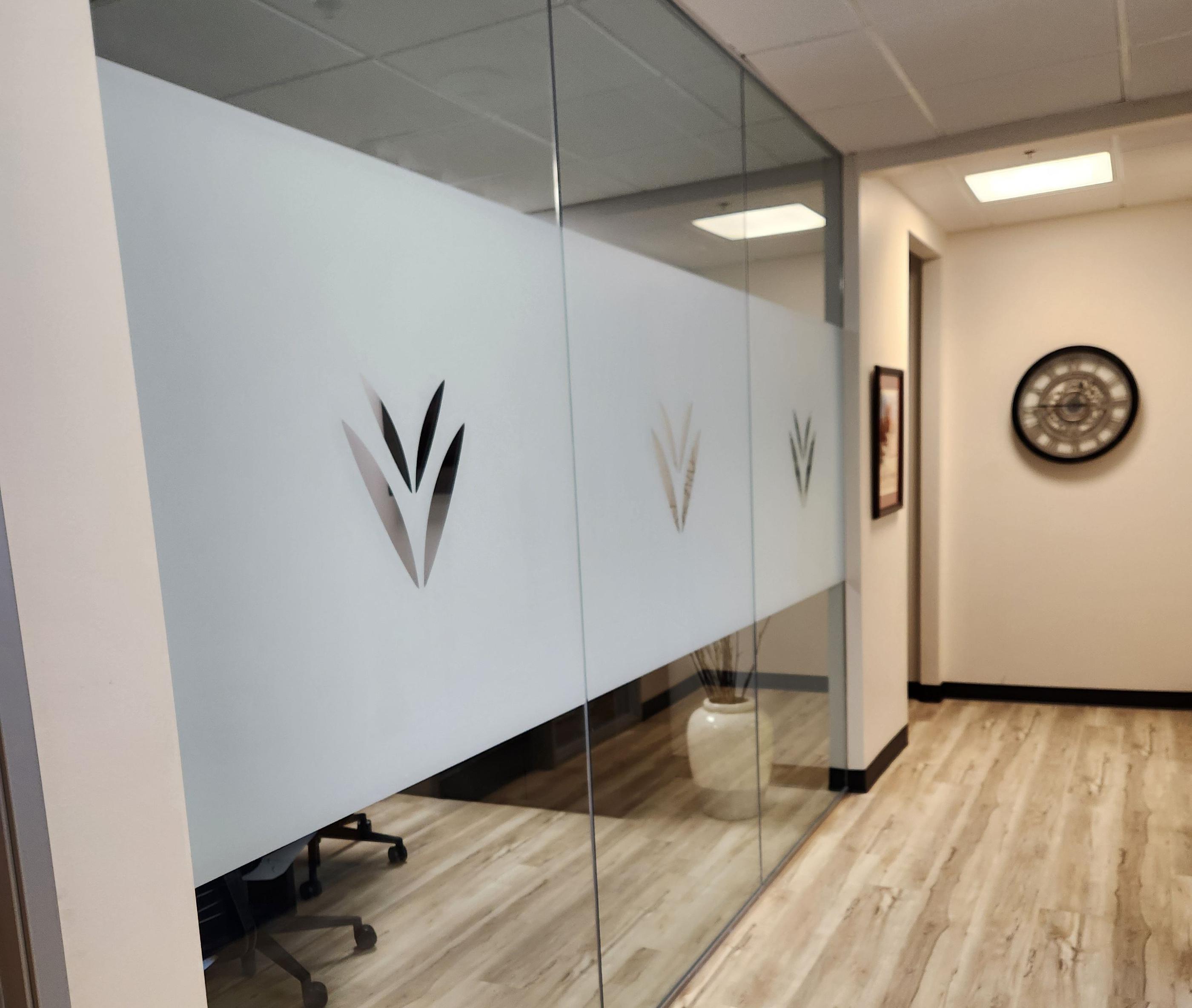Indoor window graphics etched frosted vinyl with Vistica Logo, outside office view