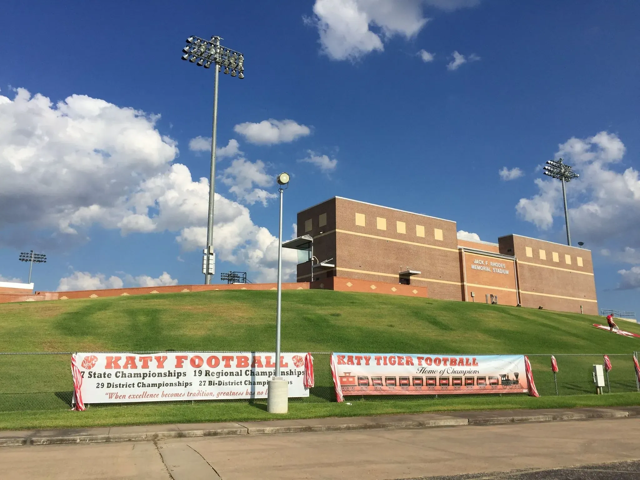 Large banners on a fence at a football stadium