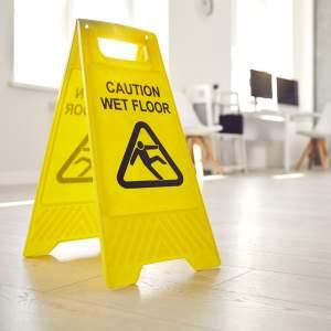 A wet floor sign in an office
