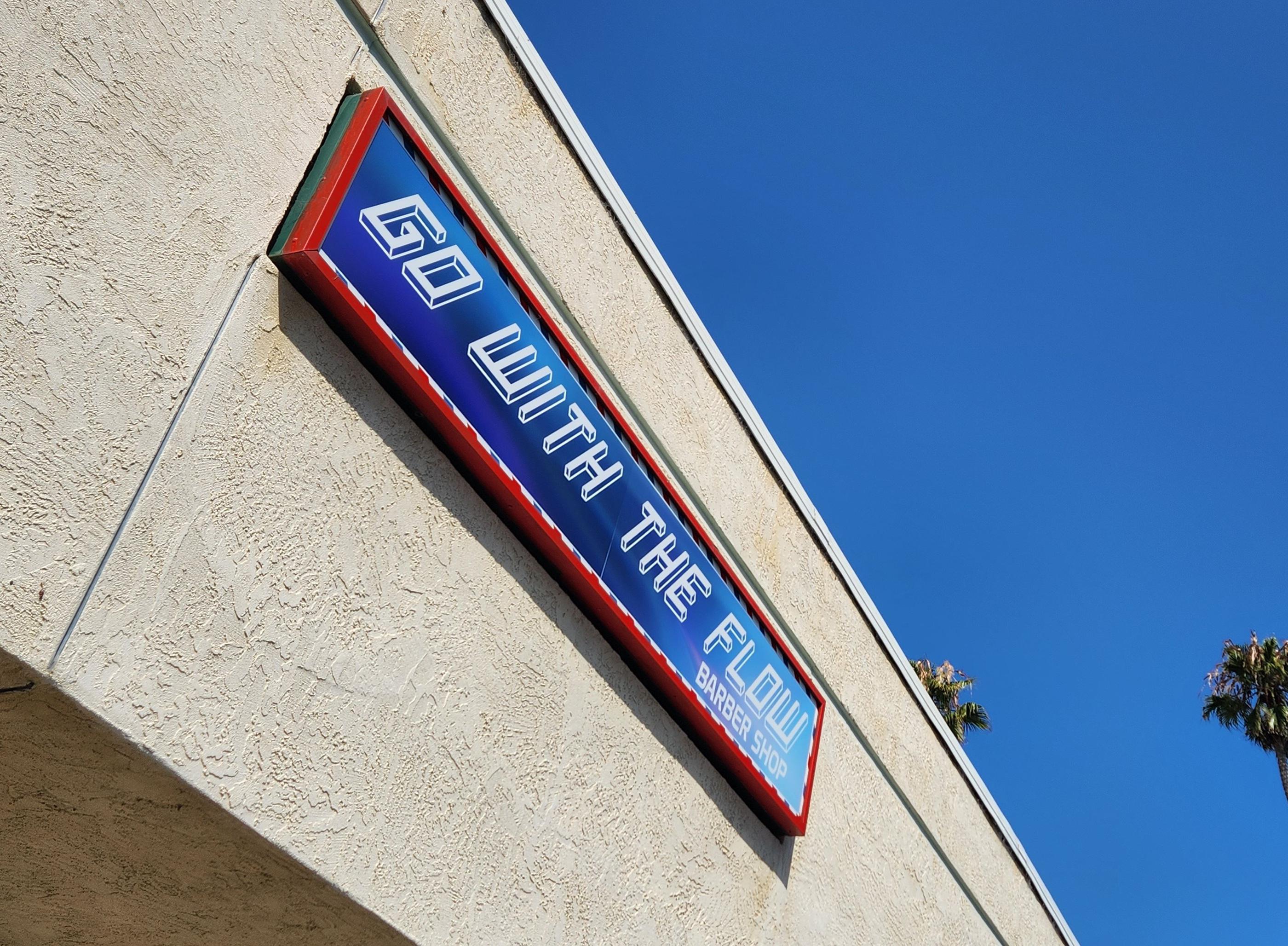 Lightbox sign on building displaying business name