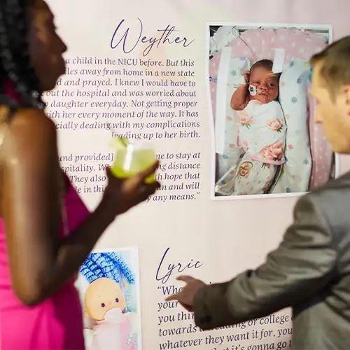 Wall display showing stories of NICU babies and families aided by Madelyn's Fund