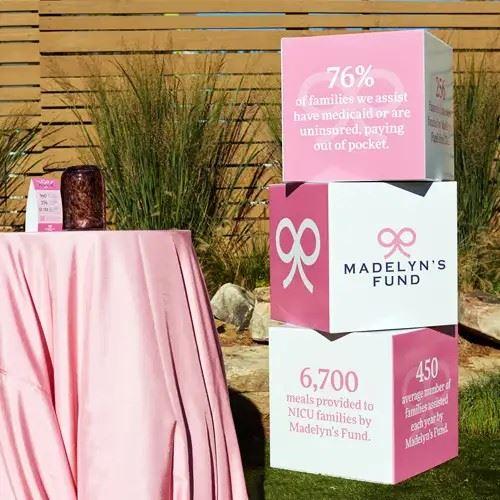 Stacked cubes display facts about the impact of Madelyn's Fund