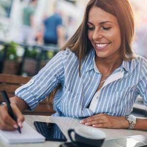 A woman happily working remote