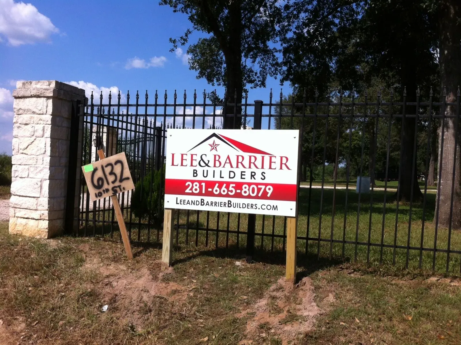 Builder yard sign on a post