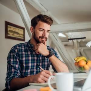 A content writer looking at his computer
