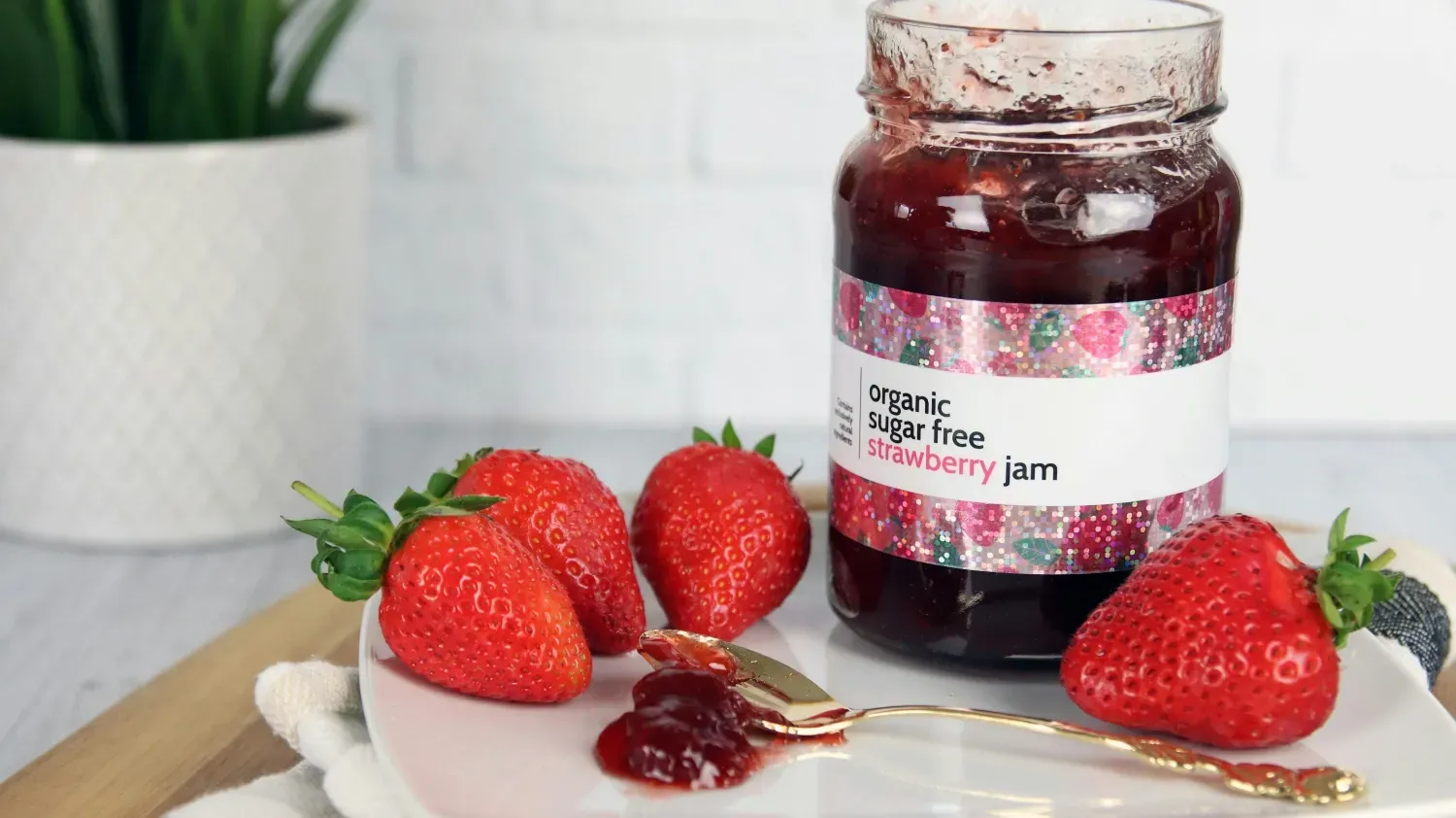 A photo of a product label for a strawberry jam jar.
