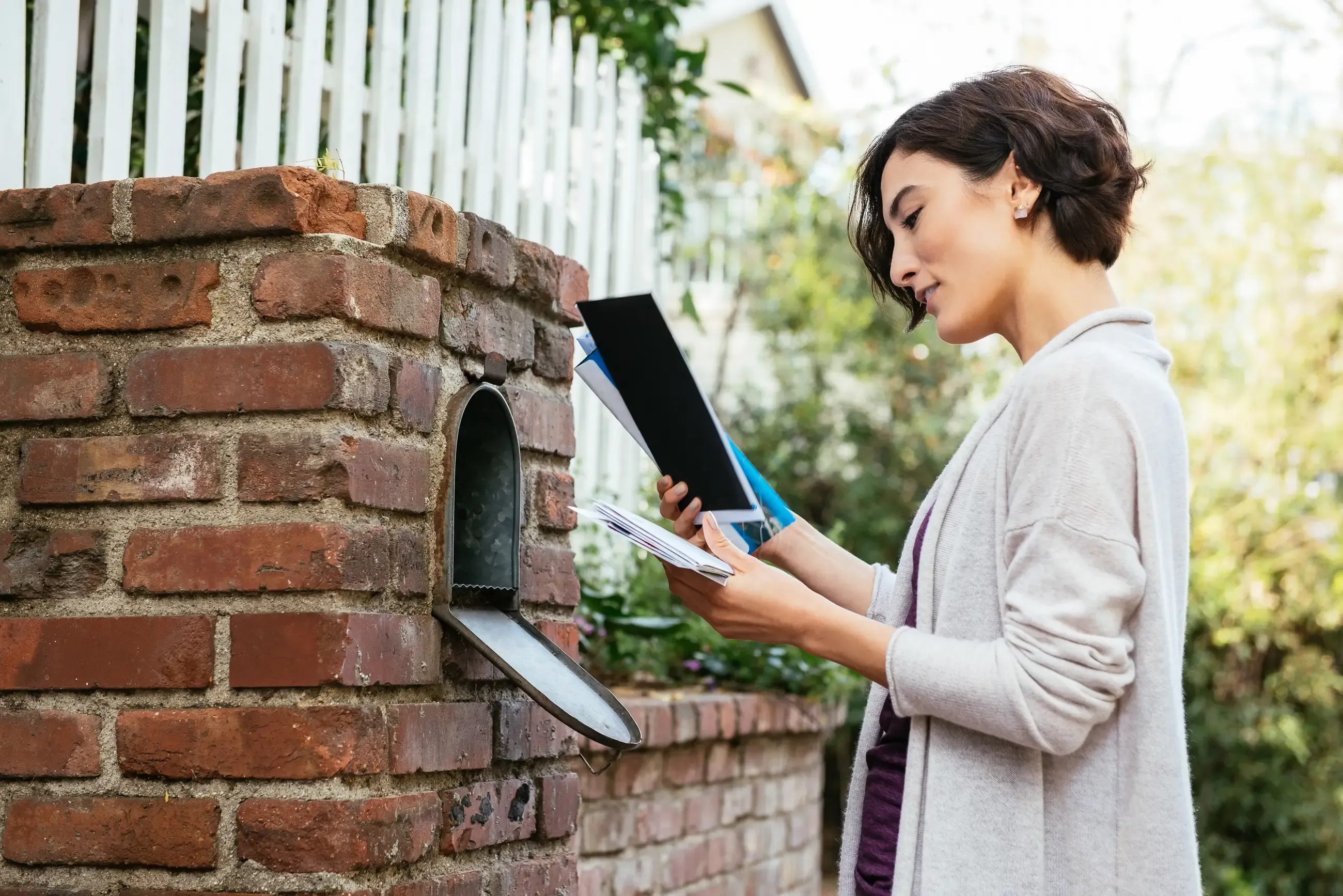 A woman getting her mail
