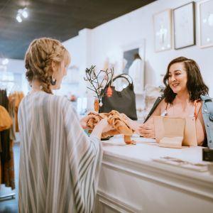 A woman at checkout at a small boutique