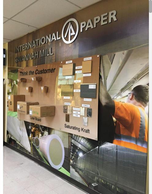 Side view of the International Paper wall display with dimensional lettering