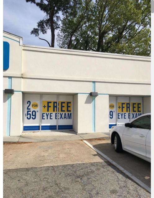 Storefront window graphics advertising a free eye exam