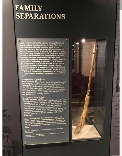 Museum exhibit panel titled Family Separations beside a display case