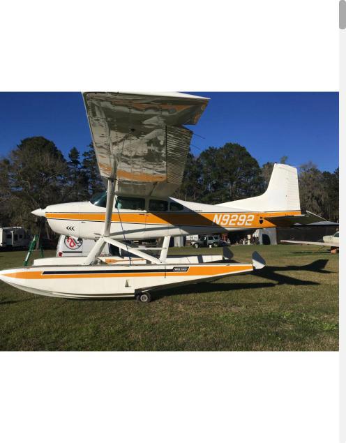 Seaplane with custom orange and yellow graphics