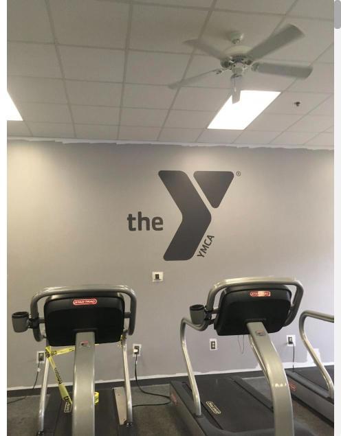 YMCA logo wall graphic in a fitness room