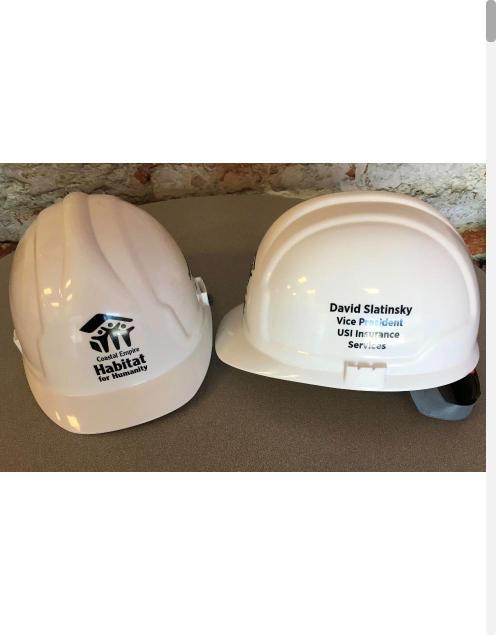 White hard hats with custom printed logos