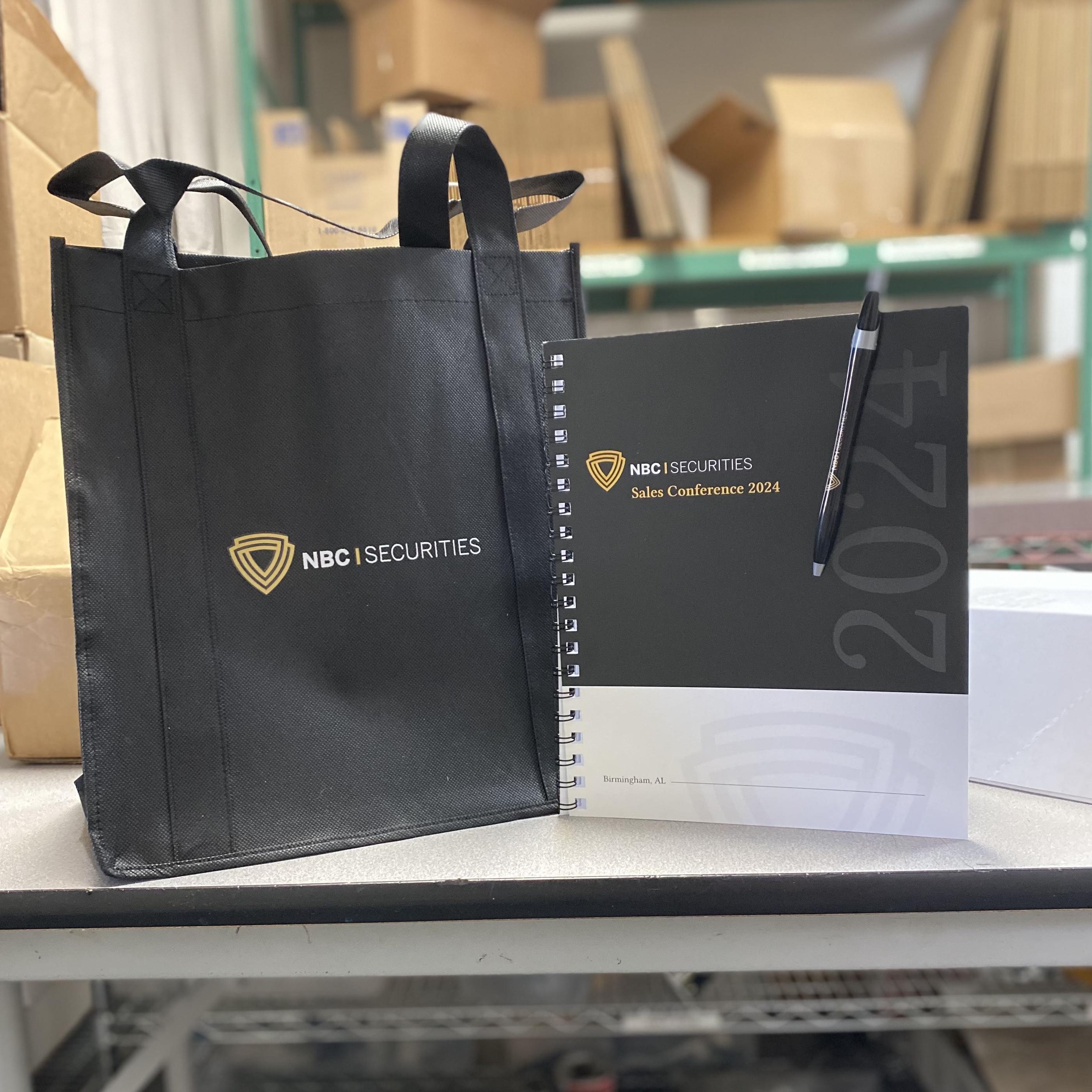 Branded tote bag, conference notebook and pen