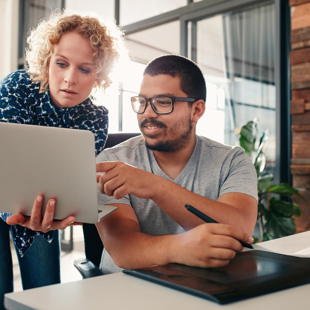 two employees working together to create a cohesive desgin