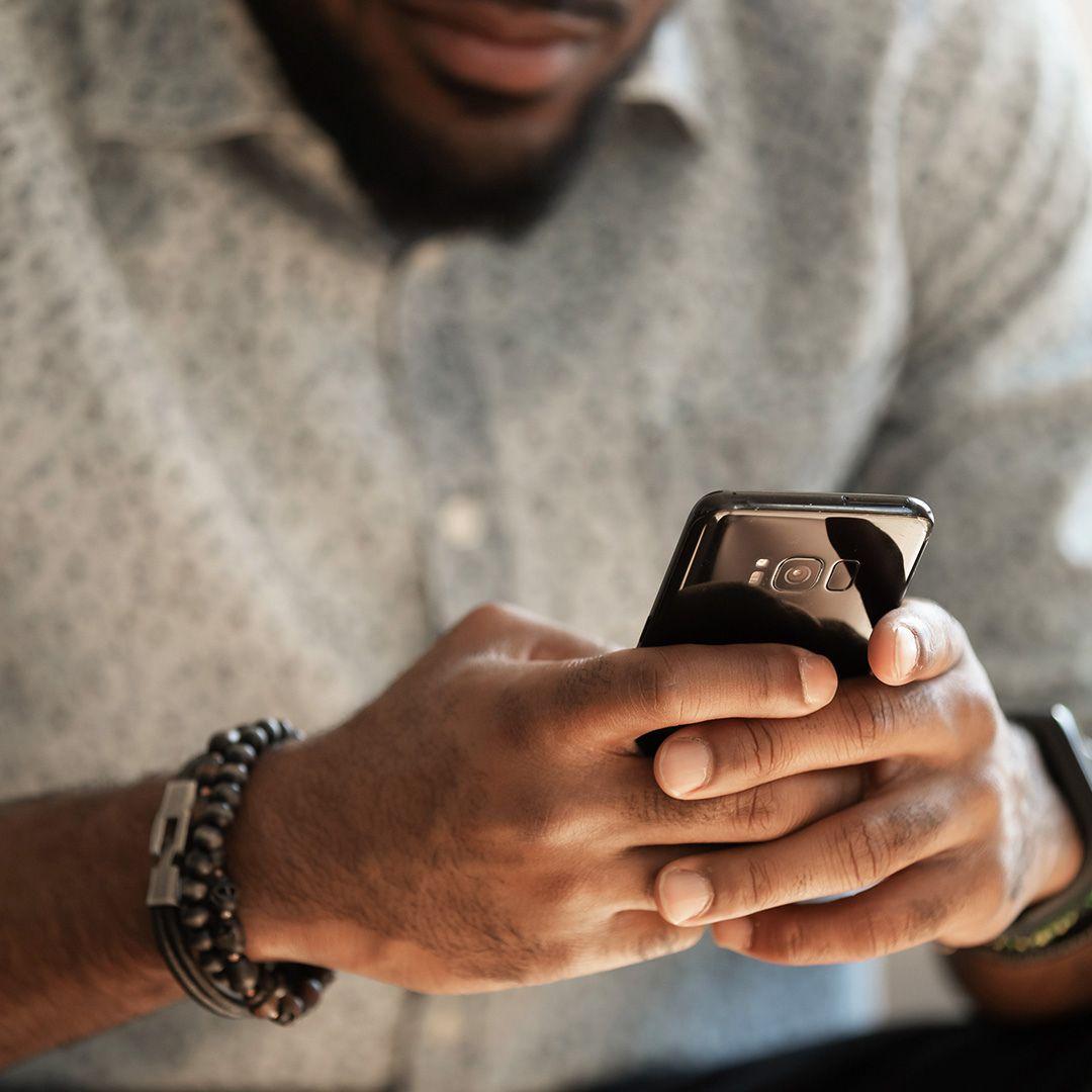 man text on his phone