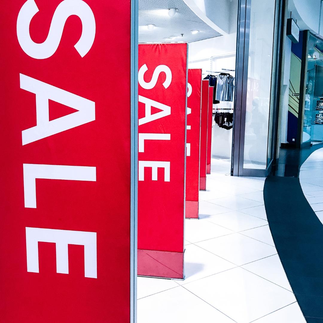 store entrance with holiday signs