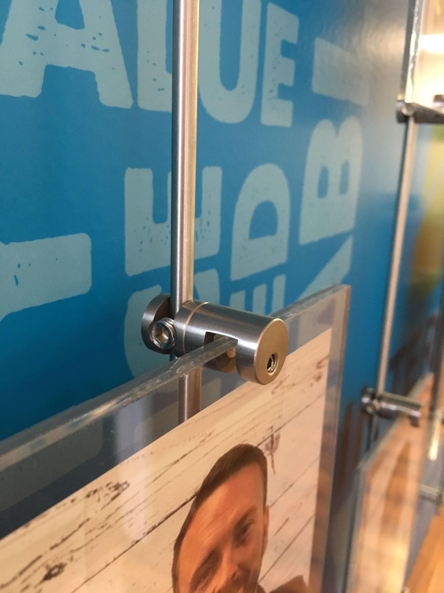 Close-up of standoff hardware holding a photo panel