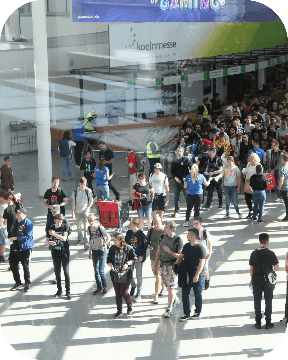 A crowd of attendees at a convention or event.