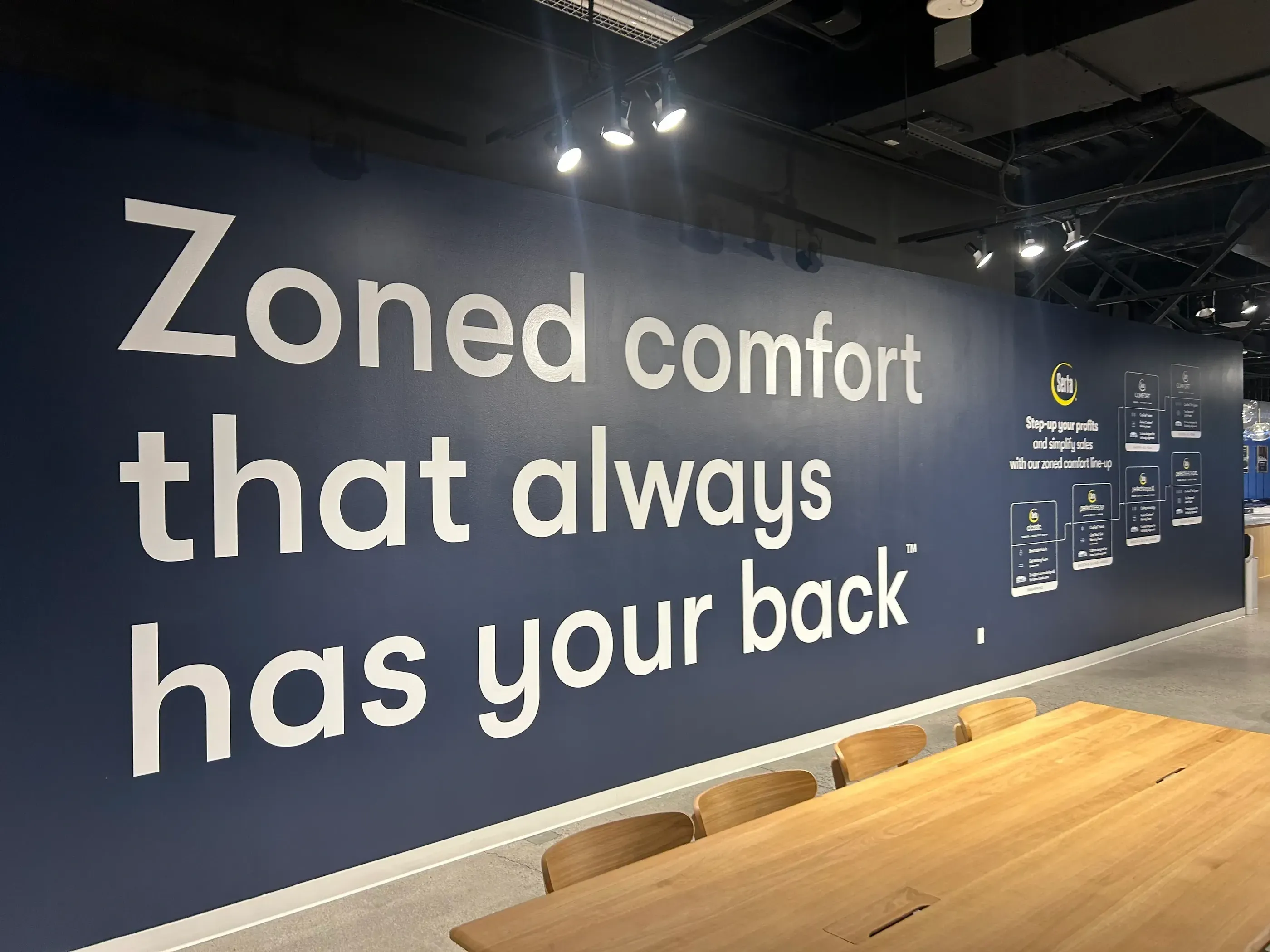 A wall graphic with a dark background and text that reads