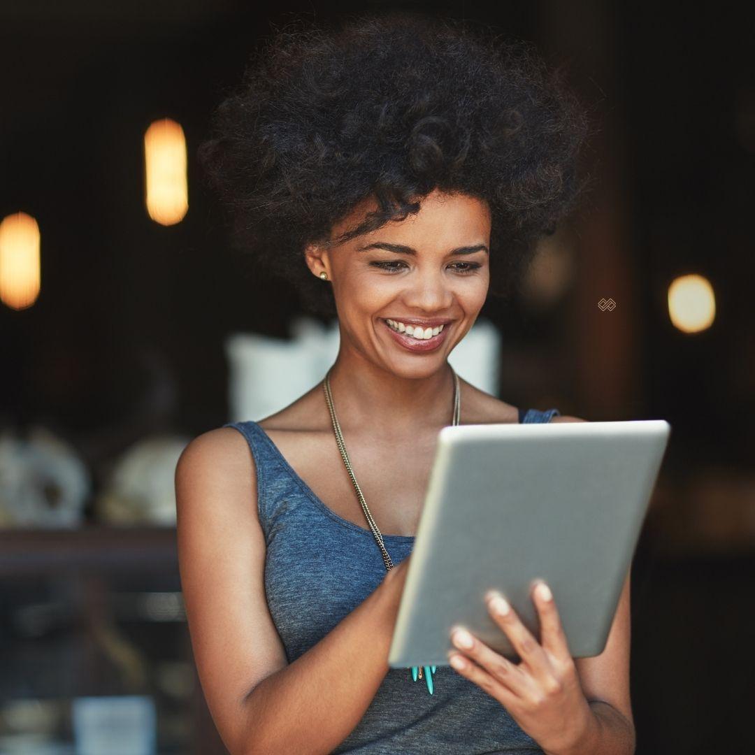 woman looking at ipad