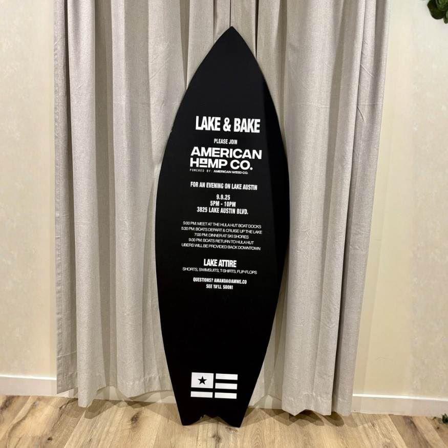 Surfboard with white cut vinyl used as an invitation