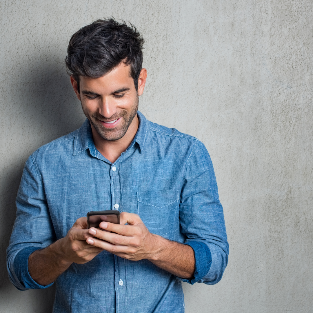 man looking at phone