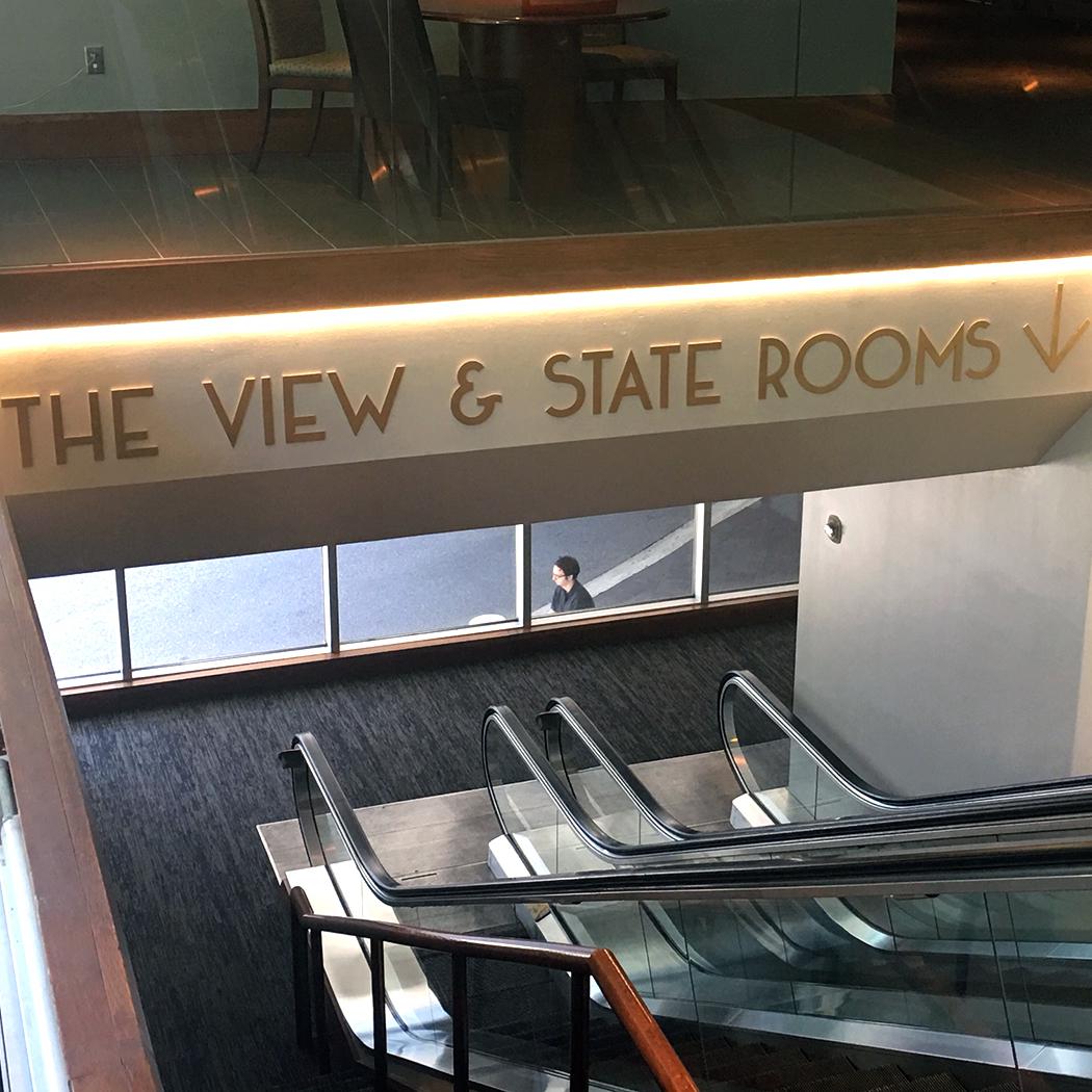 Metal Letters Above Escalator Corridor