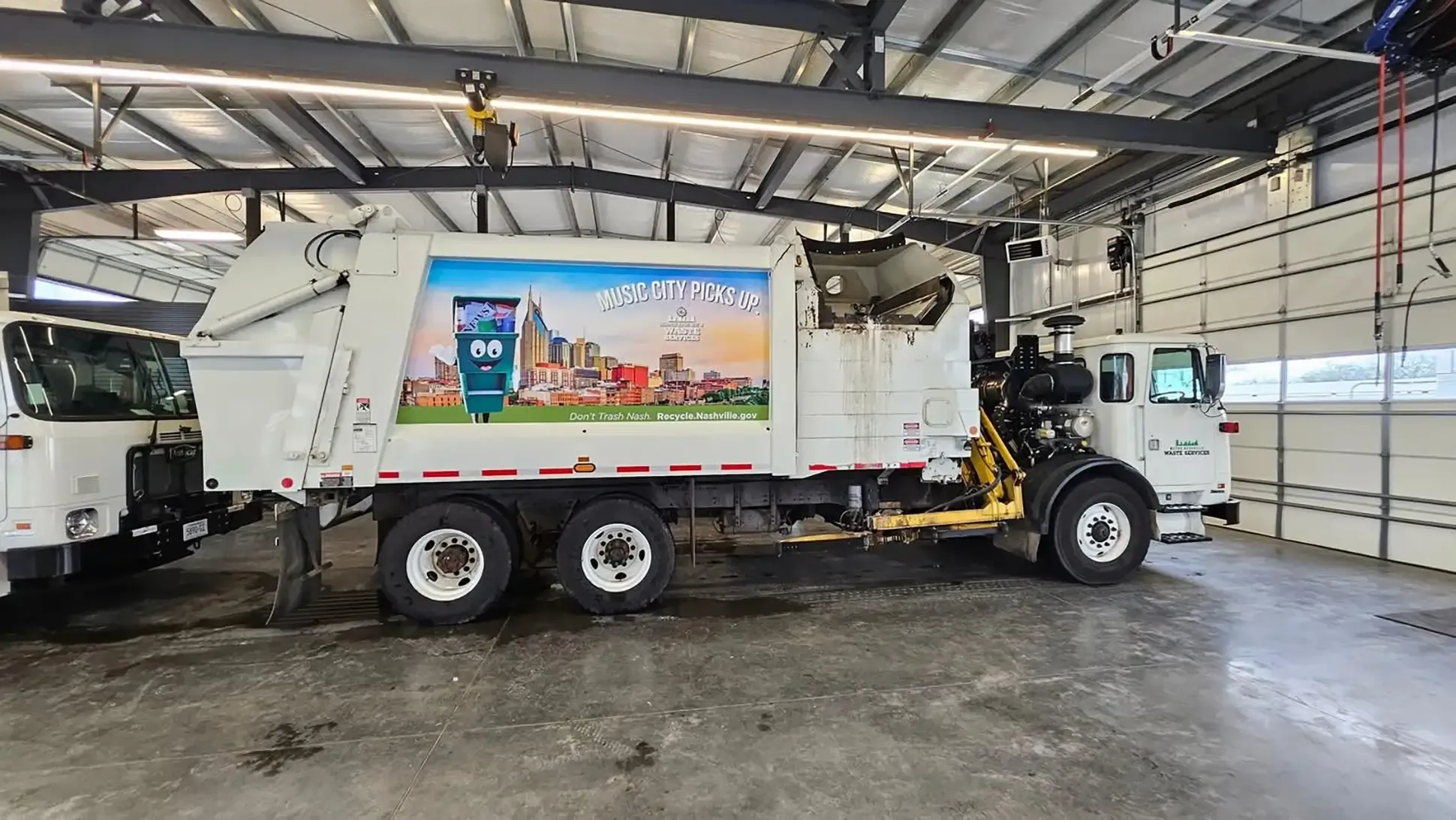Trash truck graphic at AlphaGraphics Nashville Music City