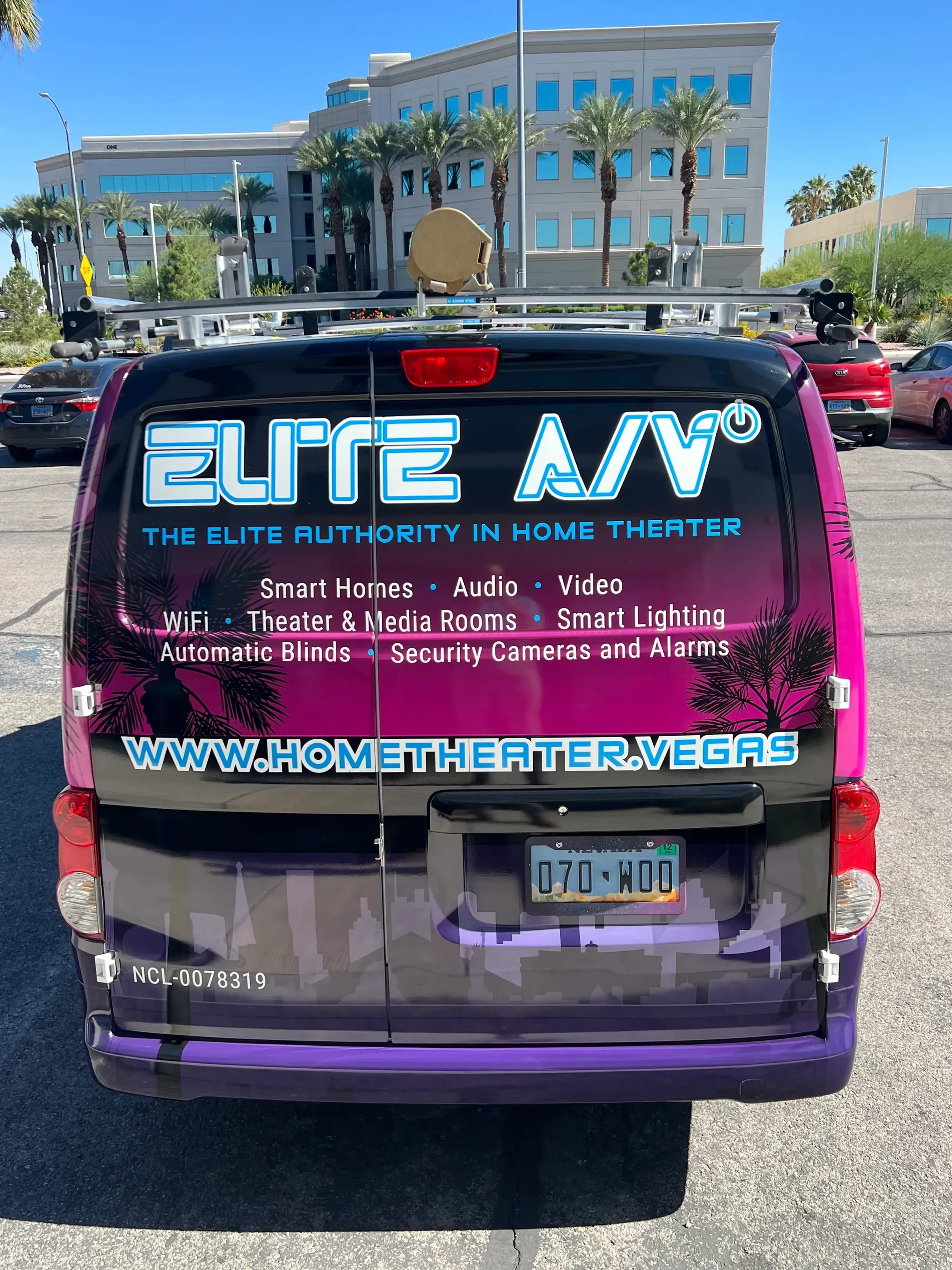 Rear view of a van branded for Elite A/V, a home theater and smart home installation company. 