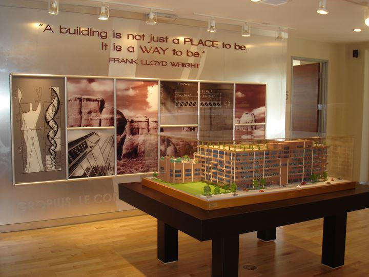 Dimensional acrylic letters with wall graphics and mounted image framing system