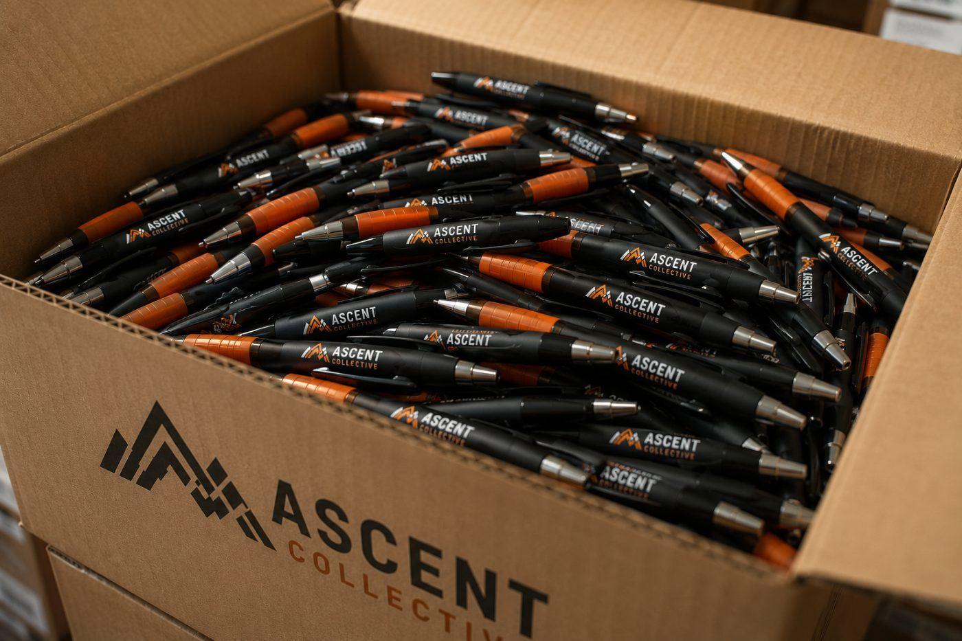 Boxes of branded pens ready for a trade show floor